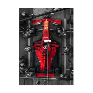 Get the adrenaline pumping with this captivating red Ferrari racing car. Perfect for car enthusiasts, this wall art will elevate any room's style.