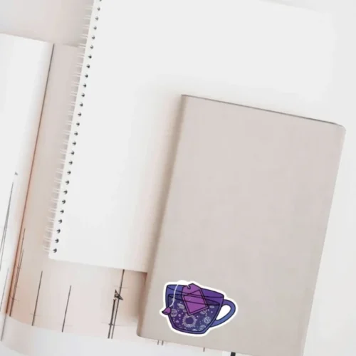 A cute space teacup sticker ideal for laptops, diaries, bottles, and more, perfect as a whimsical and celestial-themed gift.