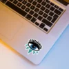 An Evil Eye aesthetic sticker ideal for laptops, diaries, bottles, and more, perfect as a gift for those who appreciate protective and mystical designs.