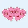 Love Hearts Sticker showcasing two whimsical hearts with eyes and long lashes.