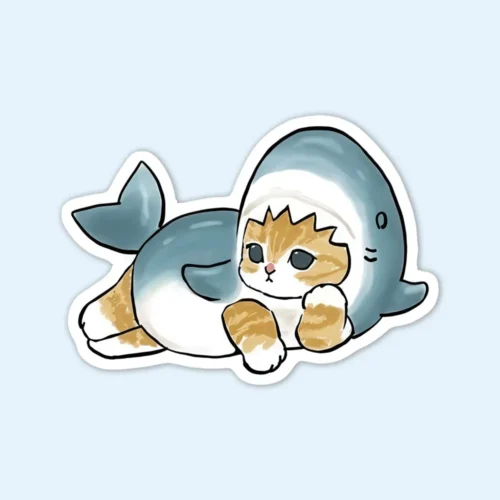 A sticker featuring a playful cat dressed in a shark costume, titled "Shark Cat Sticker."