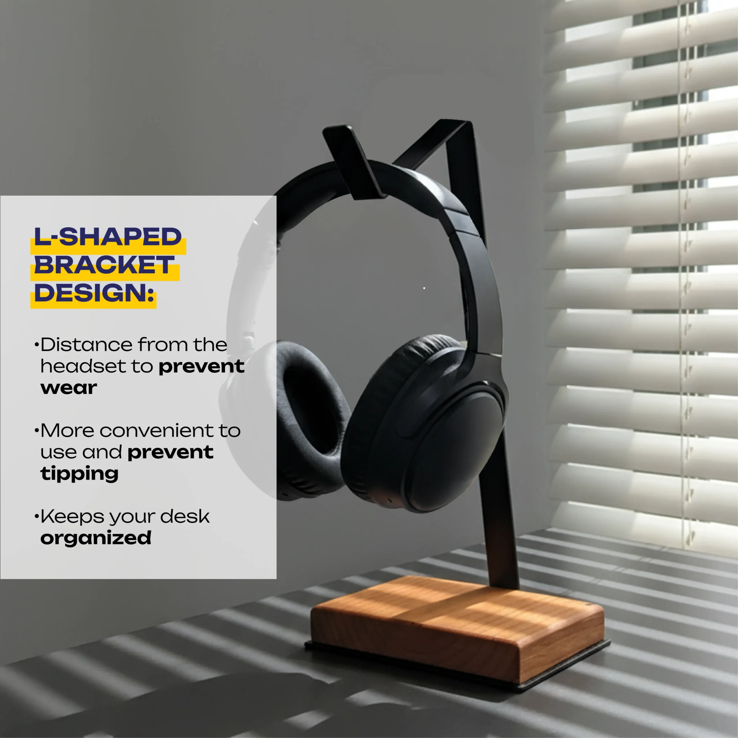 L Shaped Headphone Stand with a sleek black metal frame and premium wooden base holding white over-ear headphones on a wooden desk, showcasing a minimalist and modern workspace design.
