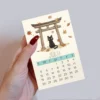 Cozy Cats 2026 Mini Desk Calendar in hand